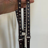 brown and silver studded skinny suspenders.