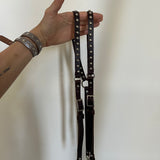 brown and silver studded skinny suspenders.